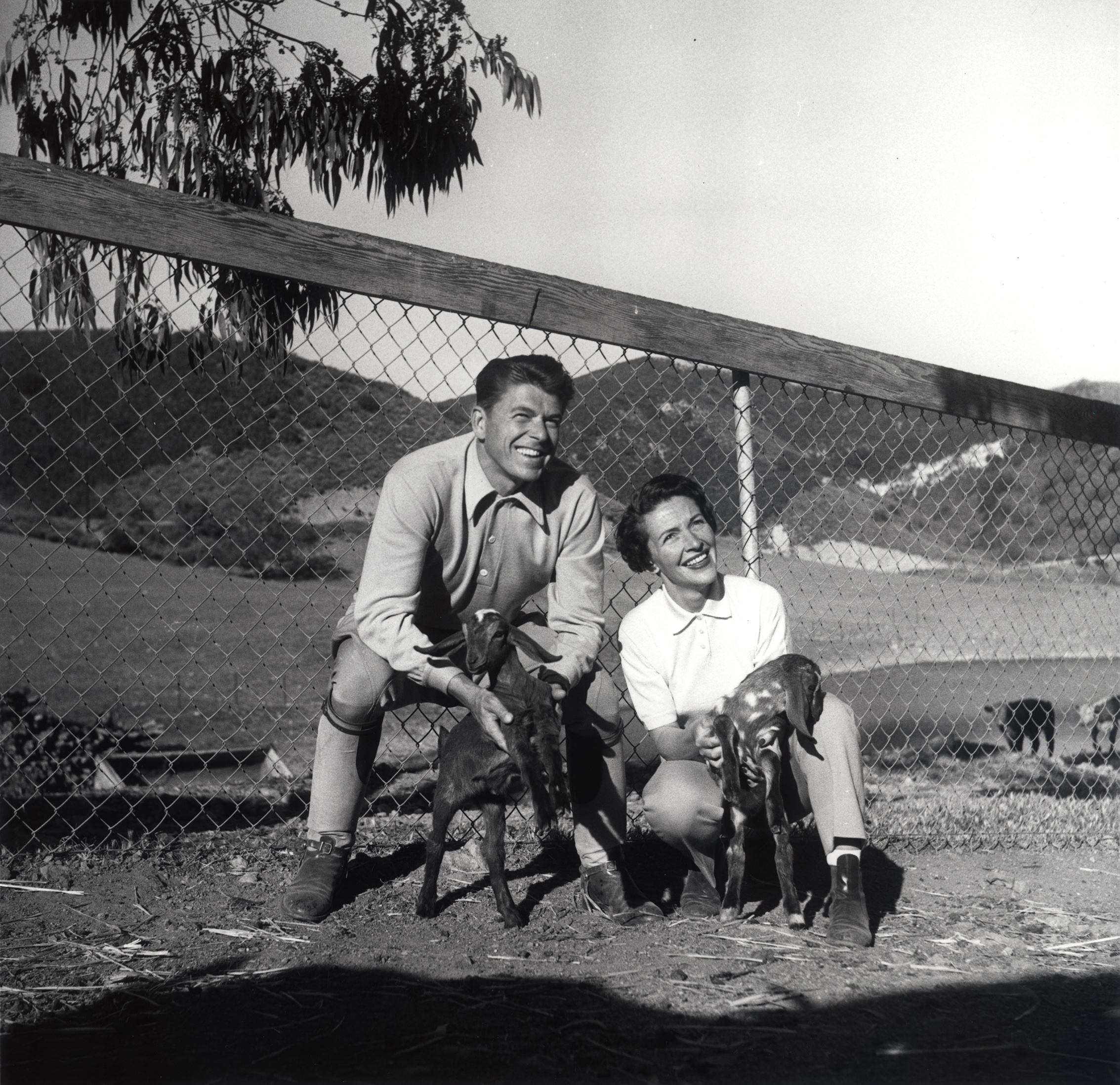Ronald Reagan and Nancy Reagan posing with their goats “Nubie” and “Heidi” at Malibu Canyon Ranch