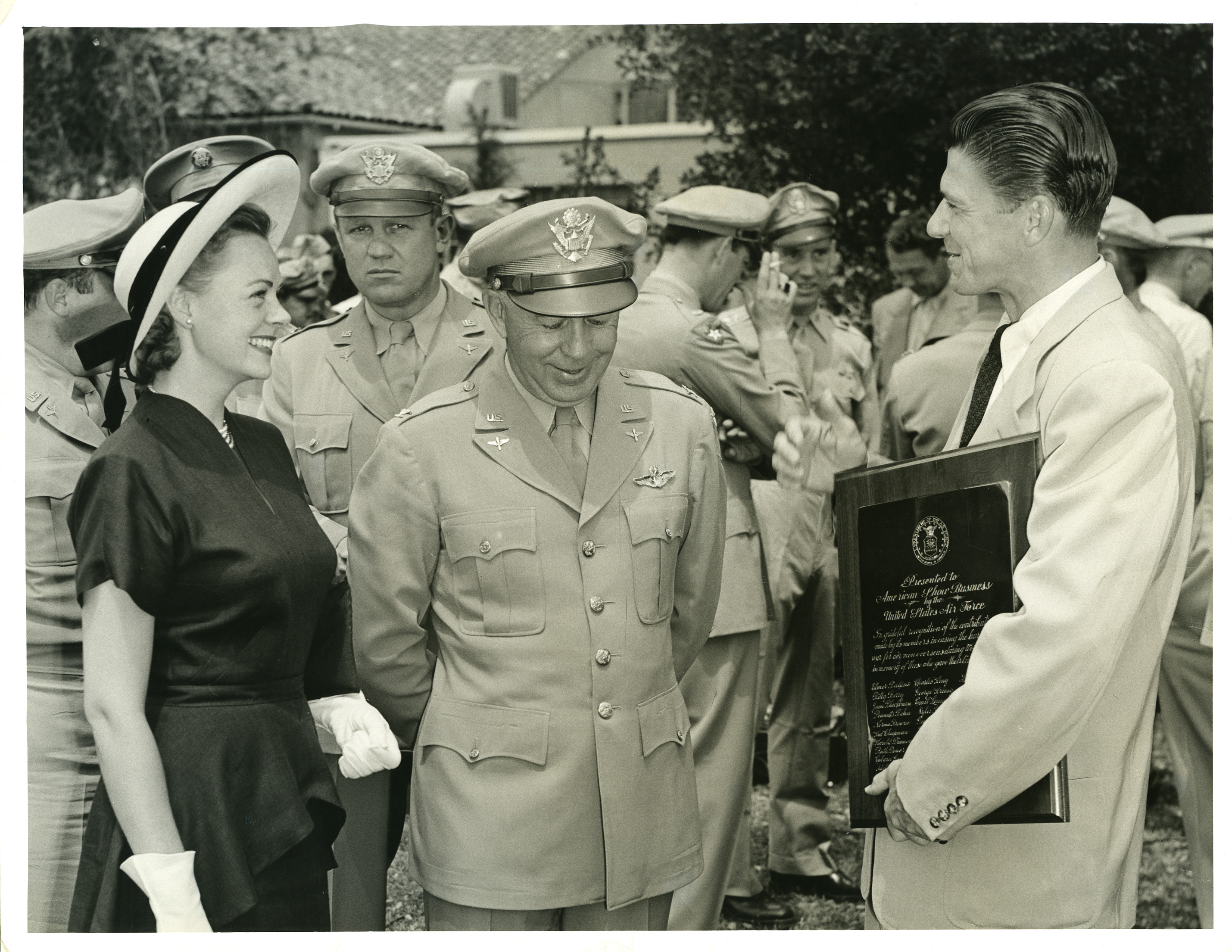 Ronald Reagan, June Lockhart, Col. Davidson (Reagan holding plaque inscribed “Presented to the American Show Business by the U.S. Air Force”