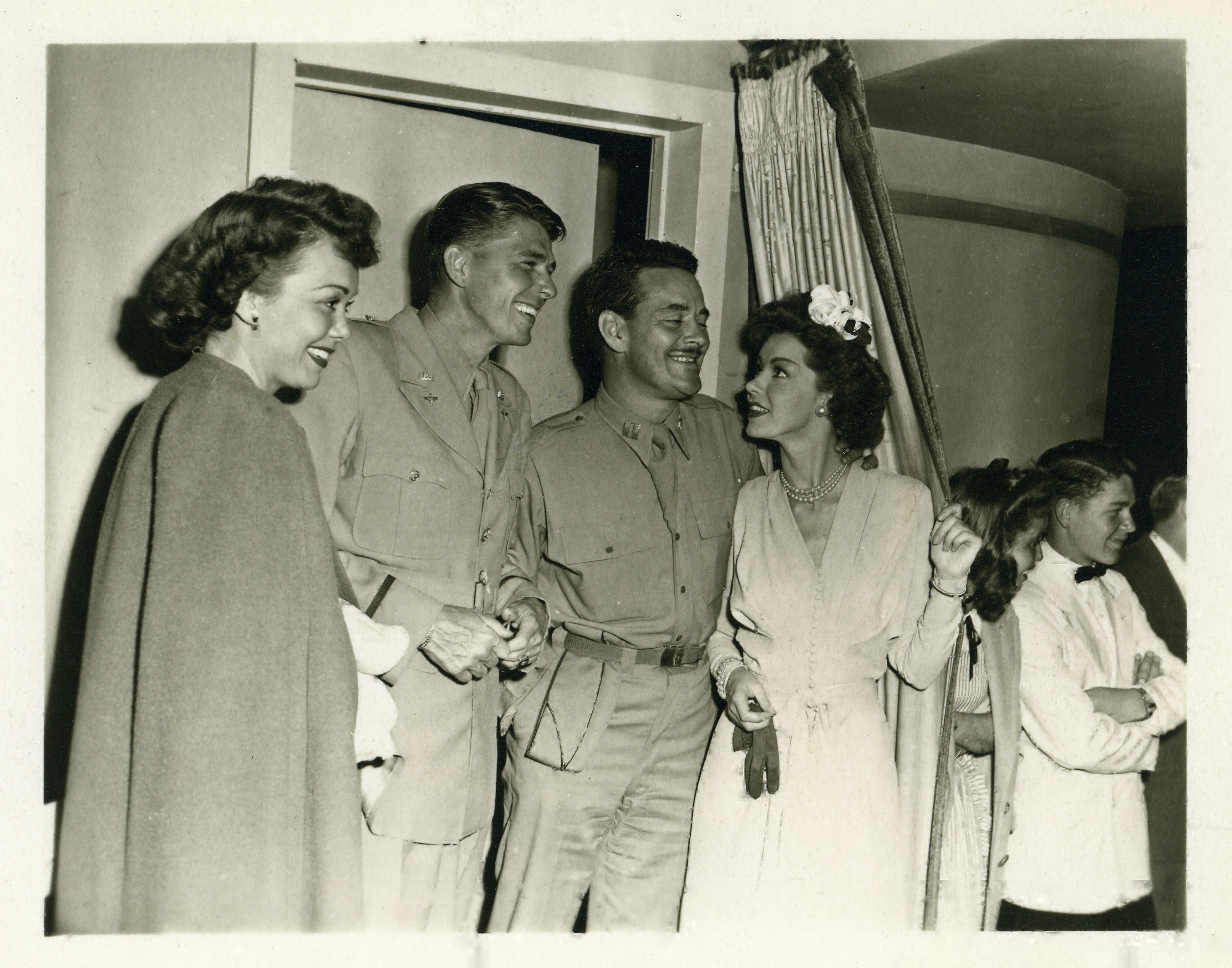 Ronald Reagan in US Army Air Force military uniform, Jane Wyman and unidentified couple, location unknown