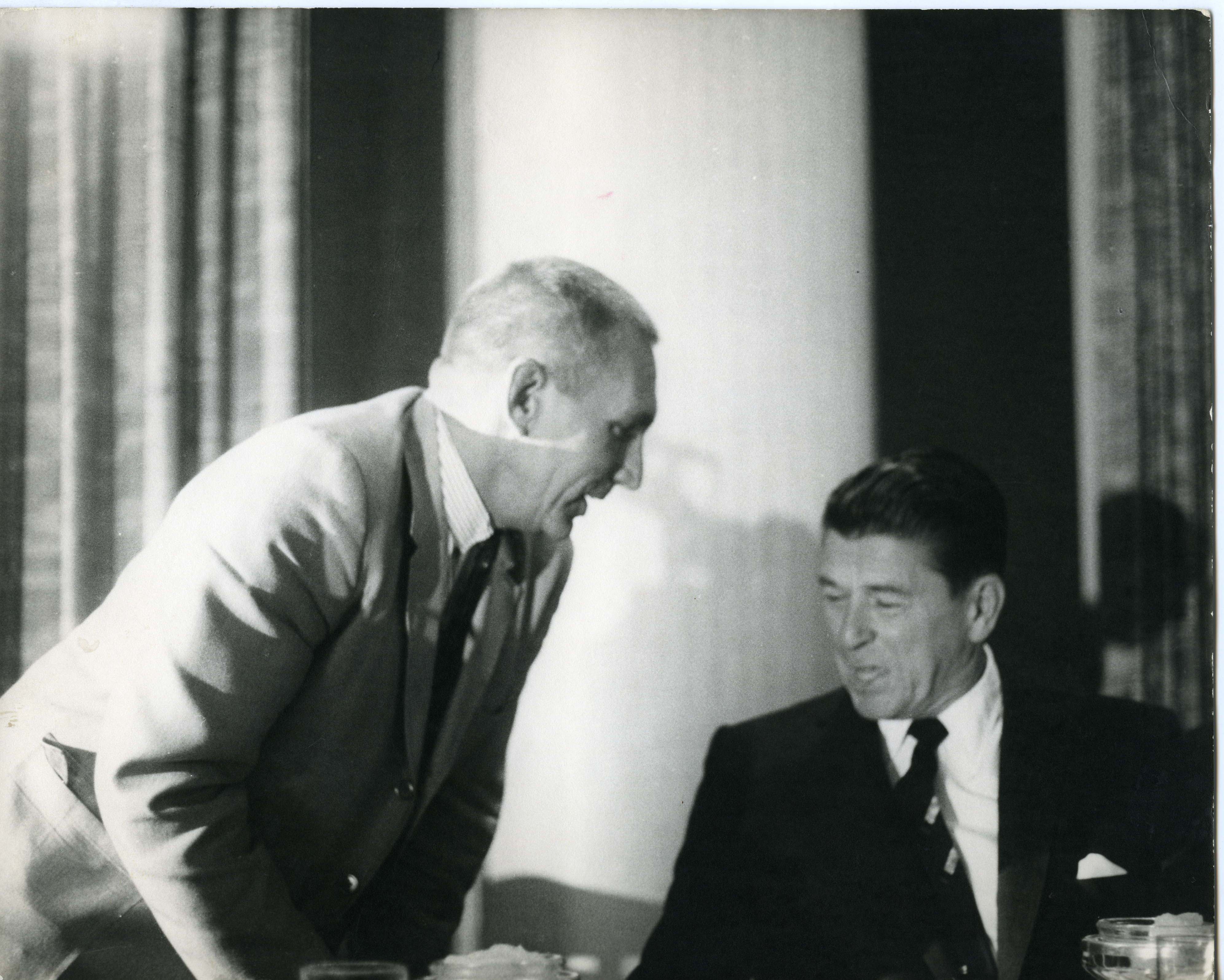 Governor Reagan talking to unidentified person at an unknown event