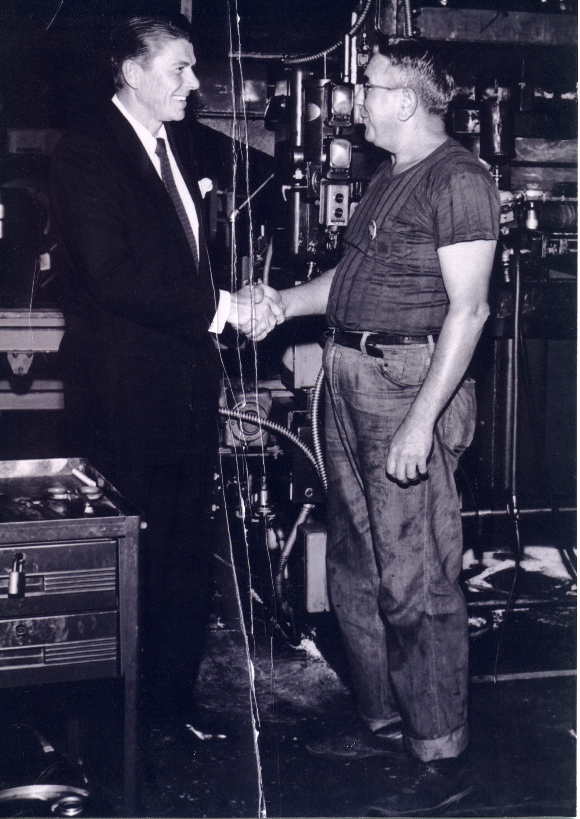 Ronald Reagan visiting with Glenn Page at a (GE) General Electric Plant