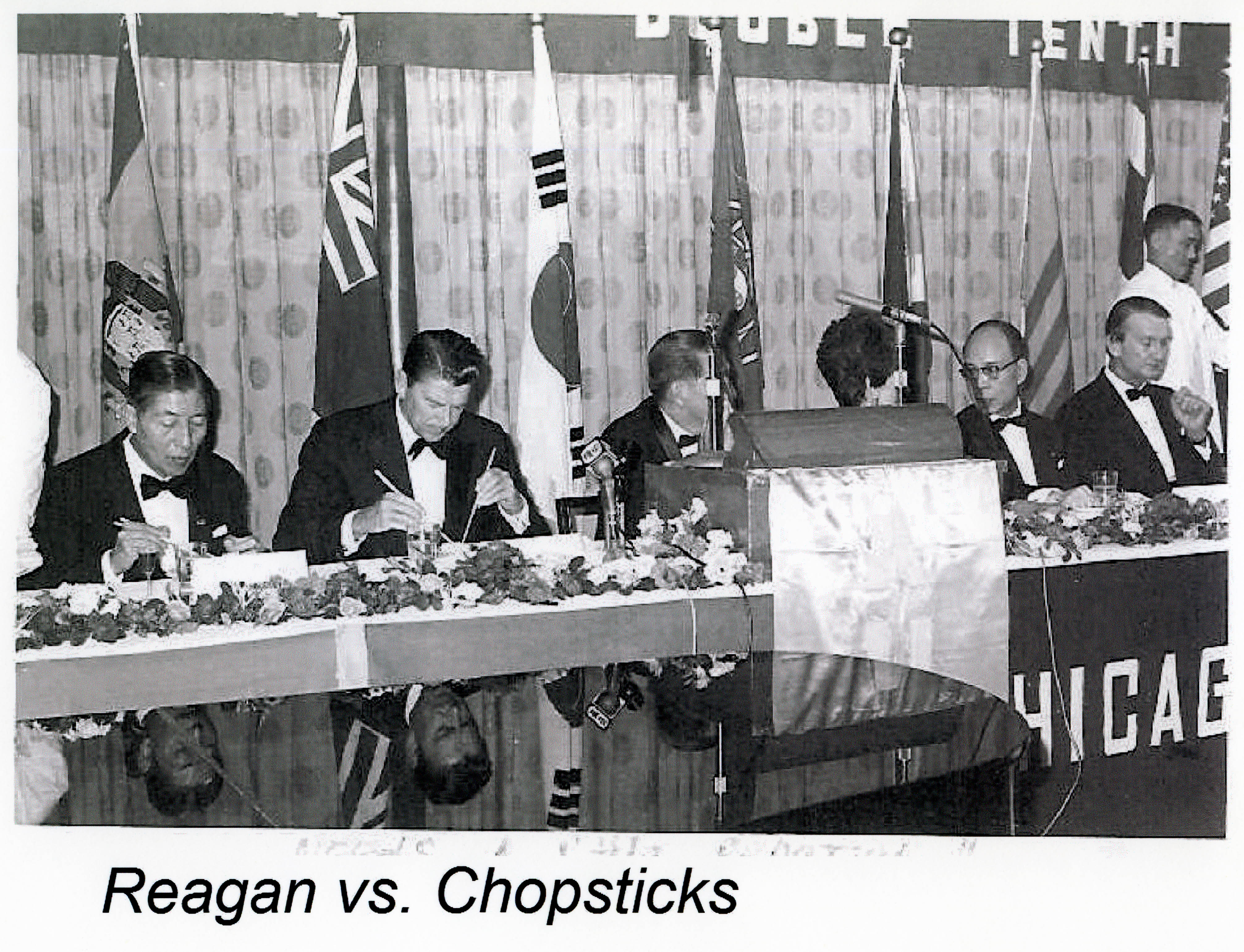 Governor Reagan using chopsticks in Taipei, Taiwan 