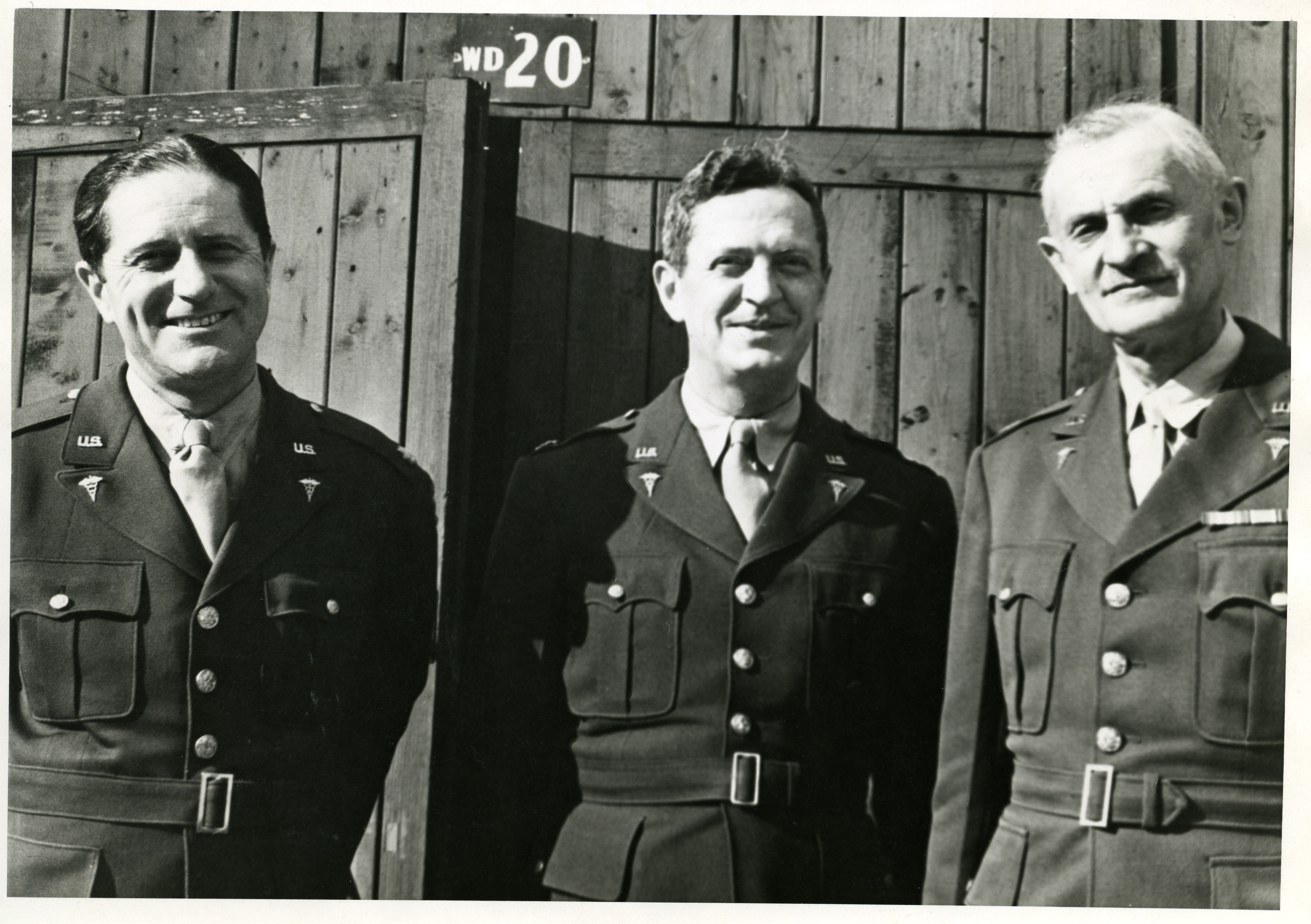 Dr. Loyal Davis in uniform with two other military officers