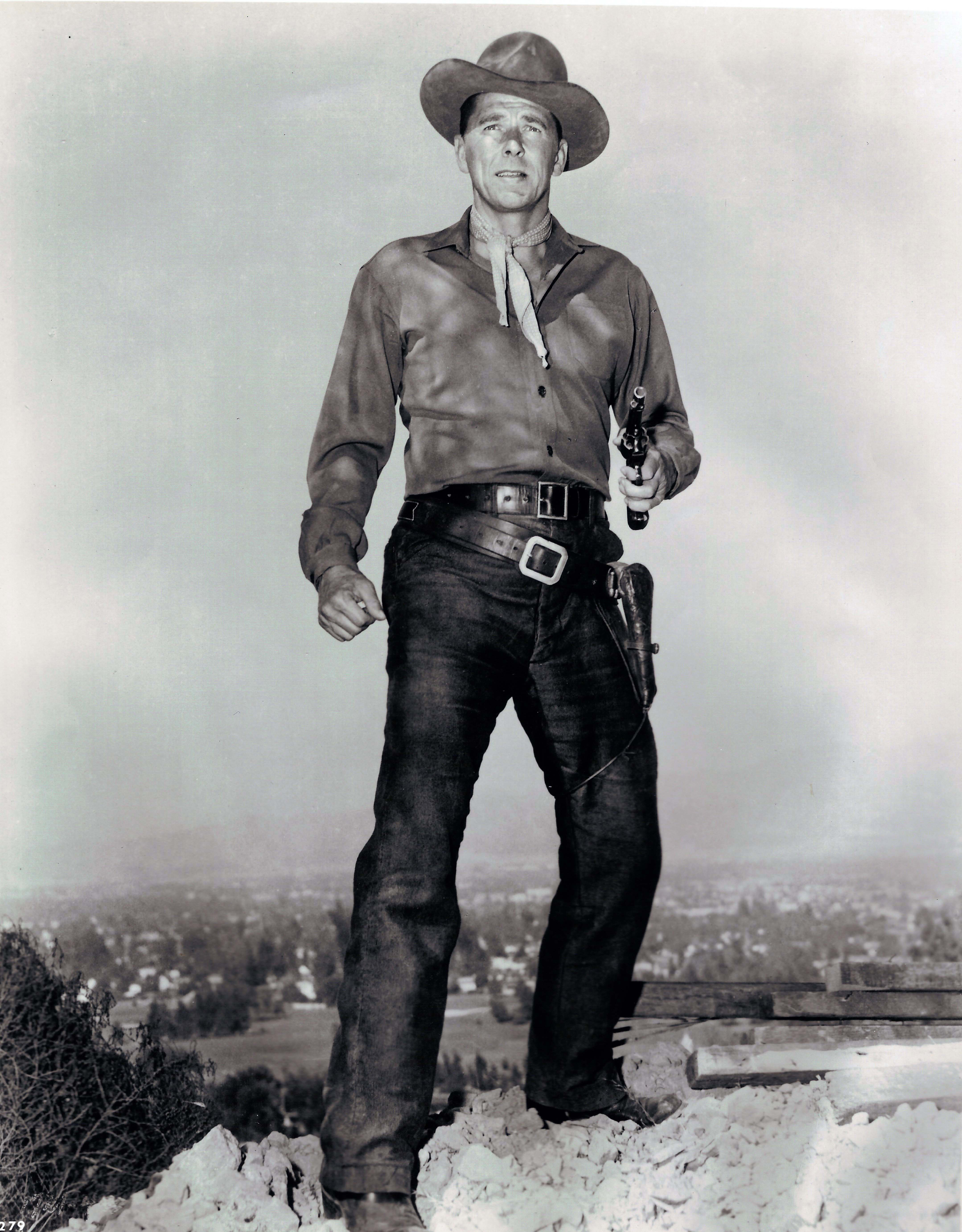 Ronald Reagan as a cowboy holding gun 9still for movie “Law and Order?”)