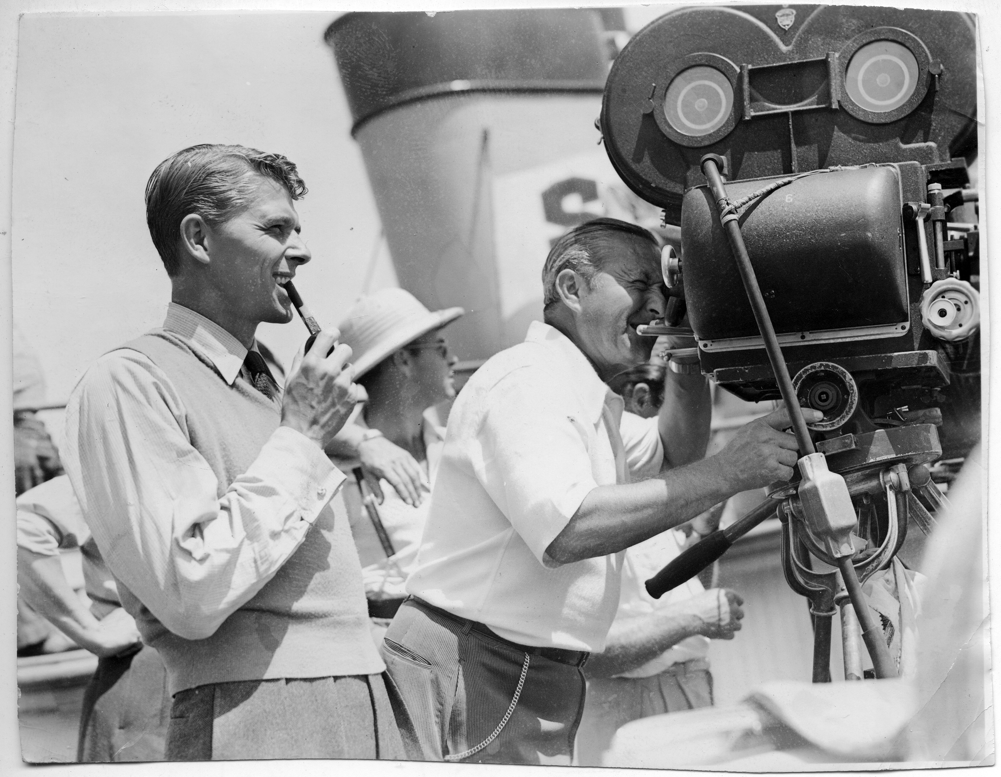 Ronald Reagan (with pipe) and Director Arthur Edeson on set of movie “Tugboat Annie Sails Again” 